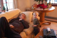 dsc_4257.jpg Devin chomps on a cookie while dad catches up on rest.