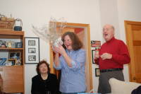 dsc_5140.jpg Margo open her swap gift to find a mug with Jimmy's picture!