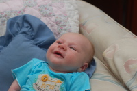 dsc_5423.jpg Devin smiles when he learns the girls from Bender gave him this onesie