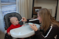 dsc_0820.jpg Devin's first solid food, brown rice cereal with squash.