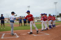 dsc_7219.jpg As the last player introduced, Grant got to exchange many pins before the game.