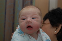 dsc_1877.jpg The nurse burps Devin.  He's holding his head up already.