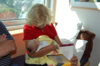 dsc_1884.jpg JoJo reads Devin his first book, "The Day You Were Born"